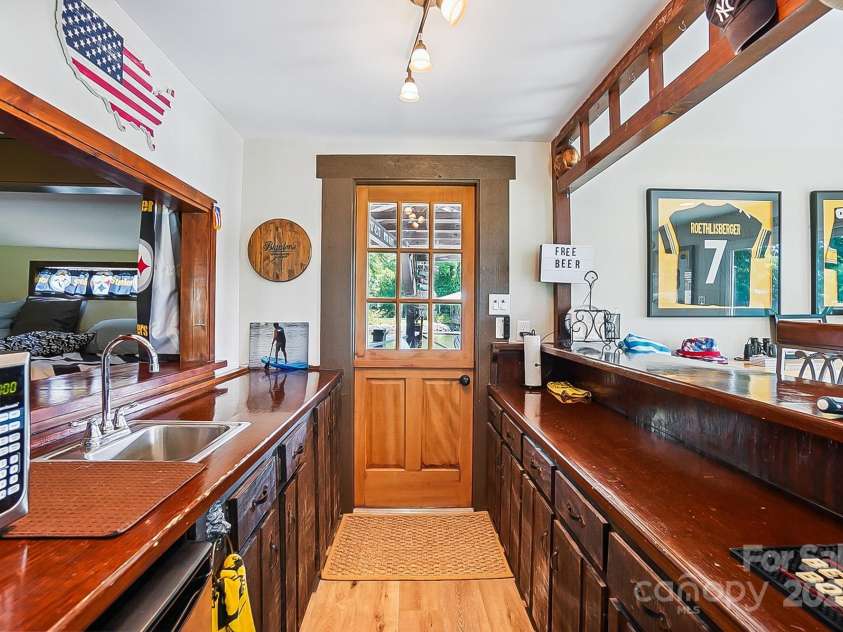 4485 River Oaks Road, Lake Wylie, SC 29710.  MLS# CAR4273028, YatesRealty ID 22521. Boathouse bar.