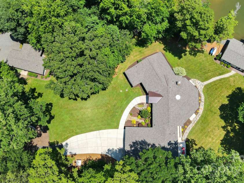 4485 River Oaks Road, Lake Wylie, SC 29710.  MLS# CAR4273028, YatesRealty ID 22521. Guest house (upper left), main (house center), Boathouse (upper right).  Over 1.6 acres with 350 +/- feet of shoreline.