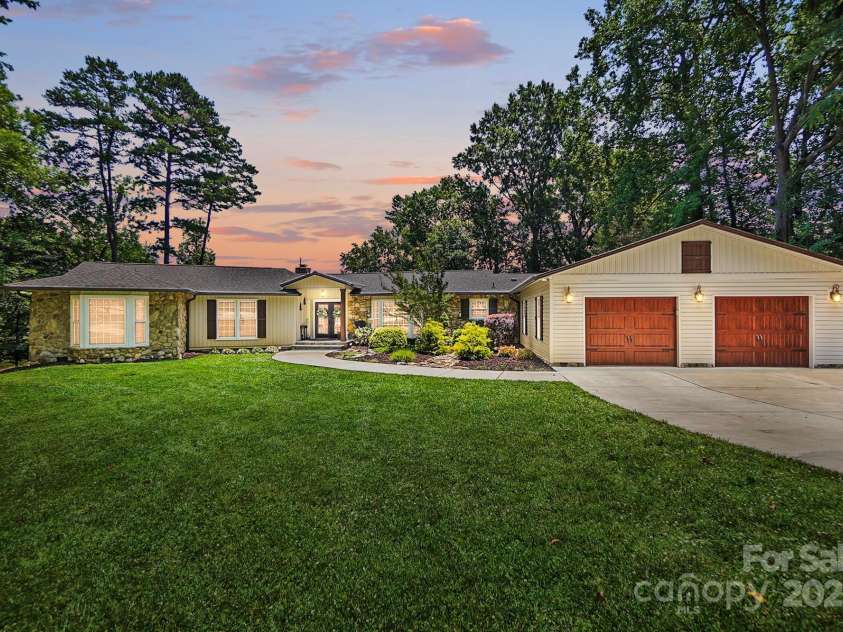 4485 River Oaks Road, Lake Wylie, SC 29710.  MLS# CAR4273028, YatesRealty ID 22521. Main house, guest house, boathouse and dock are fully updated and move-ready!