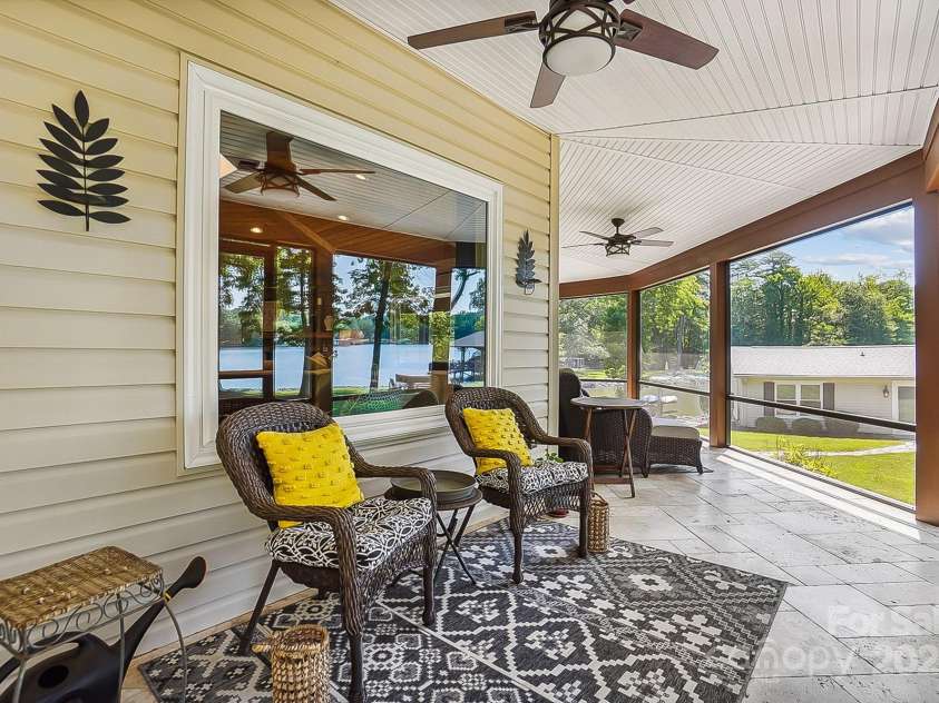 4485 River Oaks Road, Lake Wylie, SC 29710.  MLS# CAR4273028, YatesRealty ID 22521. Wonderful screen porch for ejoying morning coffee or relaxing with a great book.