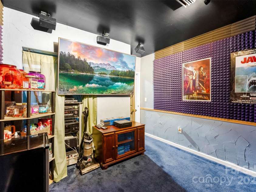 8619 Delamere Lane, Charlotte, NC 28269.  MLS# CAR4241506, YatesRealty ID 22527. Basement level bedroom furnished as media room.