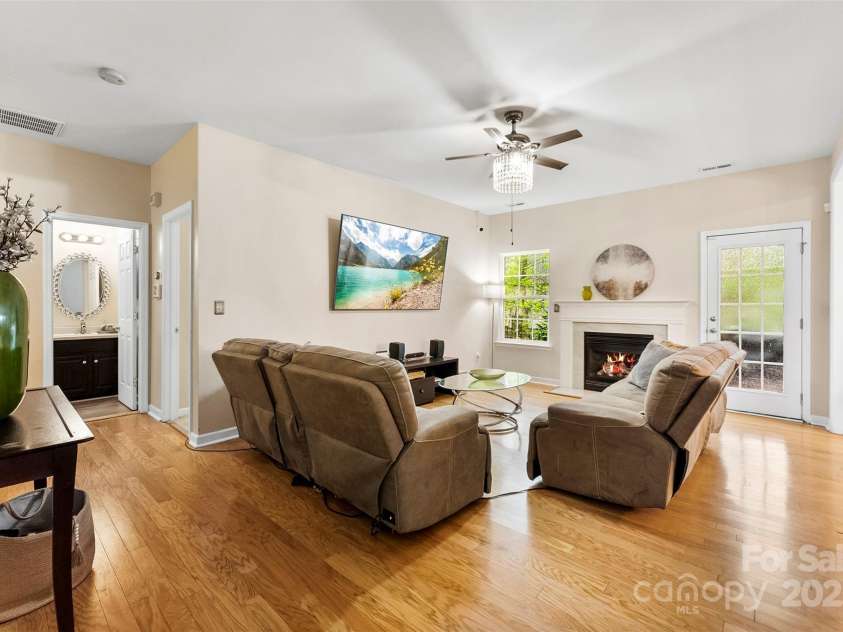 8619 Delamere Lane, Charlotte, NC 28269.  MLS# CAR4241506, YatesRealty ID 22527. Family room furnished