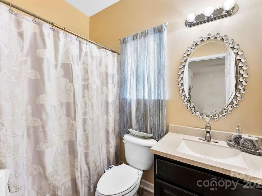 8619 Delamere Lane, Charlotte, NC 28269.  MLS# CAR4241506, YatesRealty ID 22527. Full bathroom on main furnished