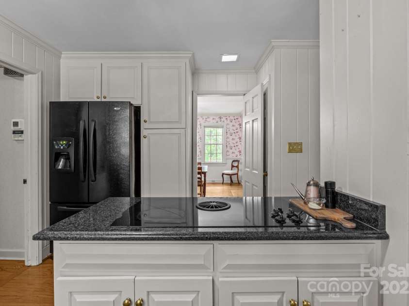 3209 Sedgefield Road, Statesville, NC 28625.  MLS# CAR4259926, YatesRealty ID 22531. Downdraft stove on island