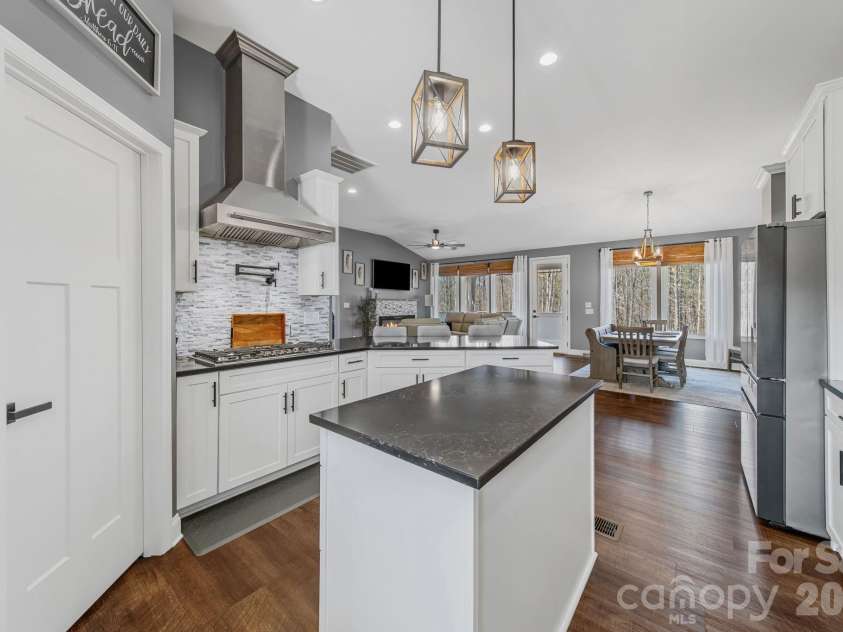 128 Laurel Ridge Drive, Statesville, NC 28677.  MLS# CAR4346436, YatesRealty ID 22532. Kitchen island conveniently located next to pantry provides additional preparation area