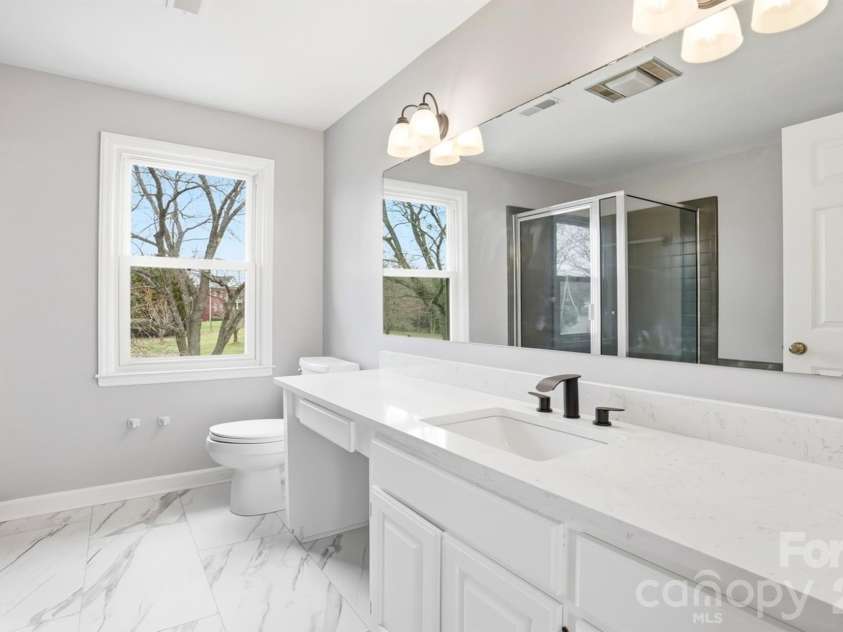5632 Zion Church Road, Concord, NC 28025.  MLS# CAR4351417, YatesRealty ID 22534. Stunning Primary Suite Bathroom