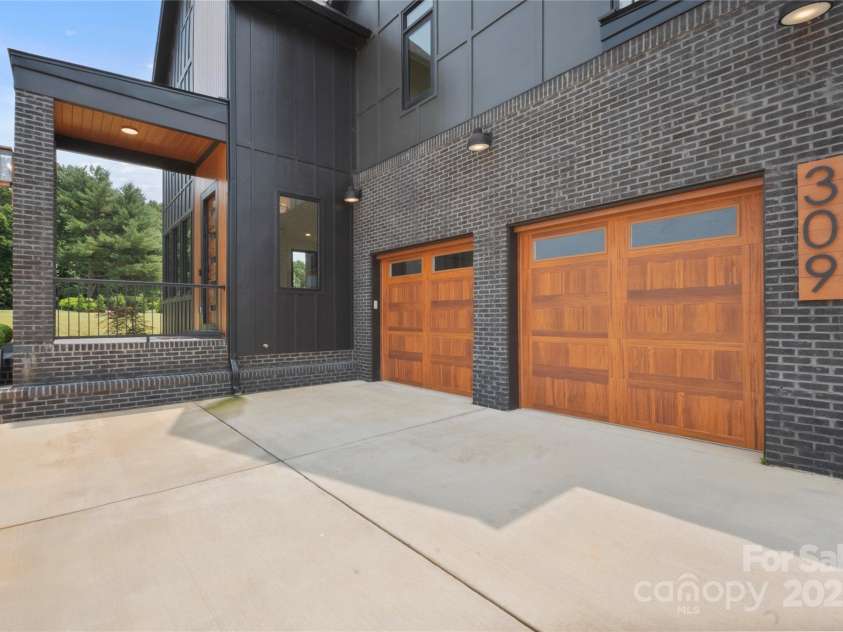 309 Sain Road, Statesville, NC 28625.  MLS# CAR4265333, YatesRealty ID 22536. 2-Car garage with solid wood doors