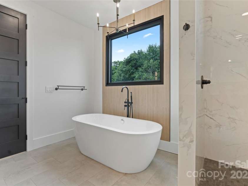 309 Sain Road, Statesville, NC 28625.  MLS# CAR4265333, YatesRealty ID 22536. Primary Bath - Free standing tub with porcelain accent wall
