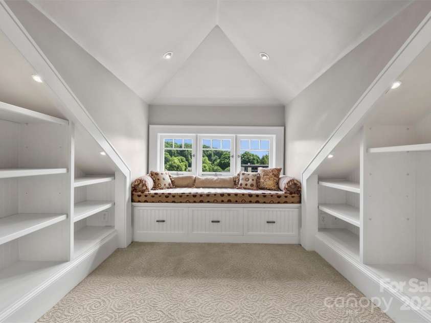 215 Main Street, Belmont, NC 28012.  MLS# CAR4134774, YatesRealty ID 22545. Front dormer has operable windows and built-ins under the inviting window seat.  Great light and cross breezes make this a comfortable space to relax in year around.