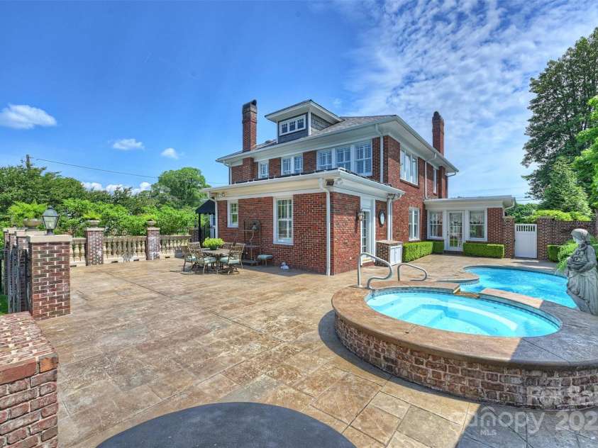 215 Main Street, Belmont, NC 28012.  MLS# CAR4134774, YatesRealty ID 22545. Looking for more room to entertain?  You found it!  This expansive outdoor terrace features concrete balustrade with brick columns.  Pre-plumbed with gas, water, and drain for outdoor kitchen option.  There is a second gas o