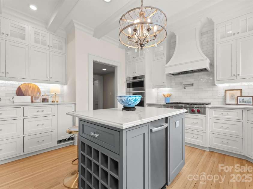 215 Main Street, Belmont, NC 28012.  MLS# CAR4134774, YatesRealty ID 22545. The heart of the home is always the kitchen.  This one has been completely renovated 3.5 years ago and features Calcutta quartz countertops, large sub-zero refrigerator and freezer that are counter depth, cabinet front, cent