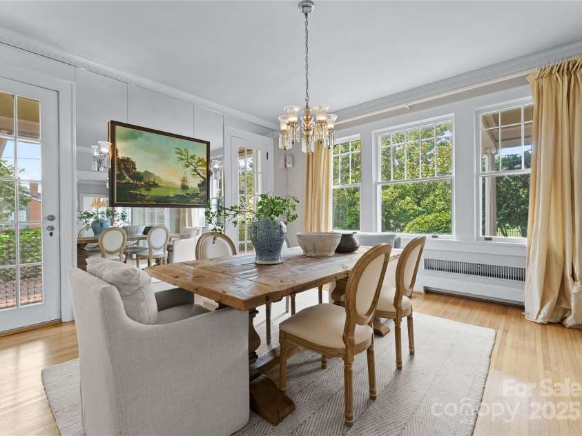 215 Main Street, Belmont, NC 28012.  MLS# CAR4134774, YatesRealty ID 22545. The large Dining room has 2 interior French doors opening to the Living Room and 2 exterior French doors leading to covered outside porch!  This room is very sunny and bright and perfect for sharing meals with family and fri