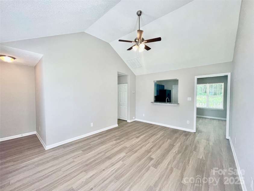 5800 Silver Eagle Drive, Charlotte, NC 28214.  MLS# CAR4267144, YatesRealty ID 22548. Living Room with Vaulted Ceiling