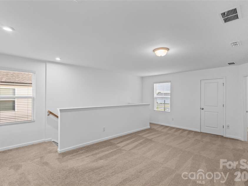 3003 Langhorne Avenue, Concord, NC 28027.  MLS# CAR4376854, YatesRealty ID 22551. Loft view from primary bedroom