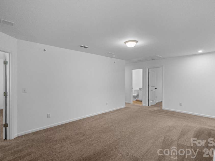 3003 Langhorne Avenue, Concord, NC 28027.  MLS# CAR4376854, YatesRealty ID 22551. Loft view toward primary bedroom