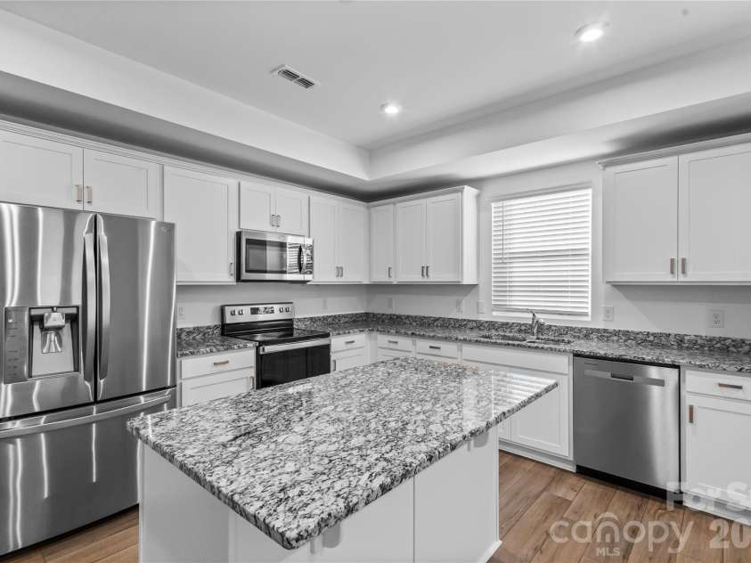 3003 Langhorne Avenue, Concord, NC 28027.  MLS# CAR4376854, YatesRealty ID 22551. Spacious Kitchen, ample kitchen storage.