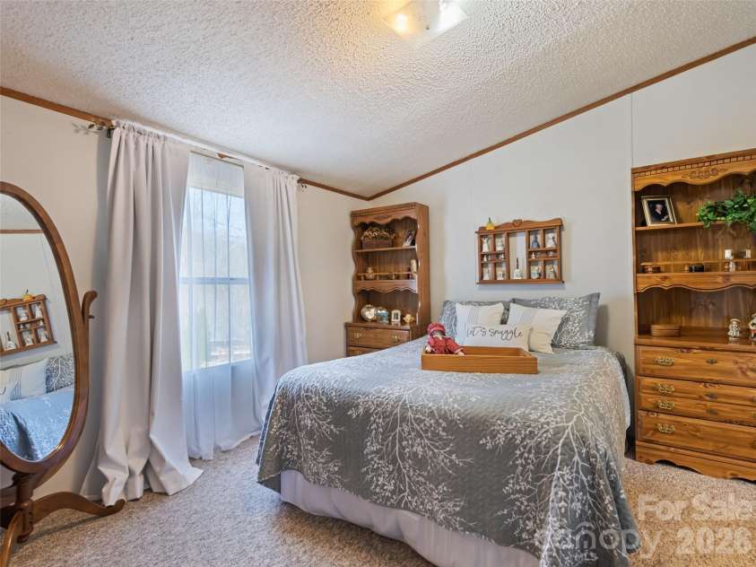 136 Peaceful Valley Drive, Leicester, NC 28748.  MLS# CAR4378331, YatesRealty ID 22556. Primary Bedroom