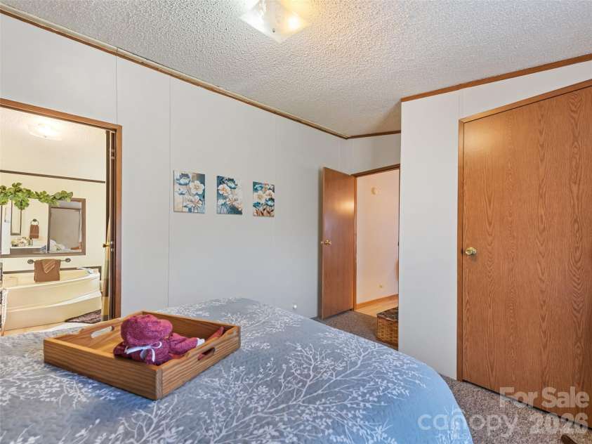 136 Peaceful Valley Drive, Leicester, NC 28748.  MLS# CAR4378331, YatesRealty ID 22556. Primary Bedroom