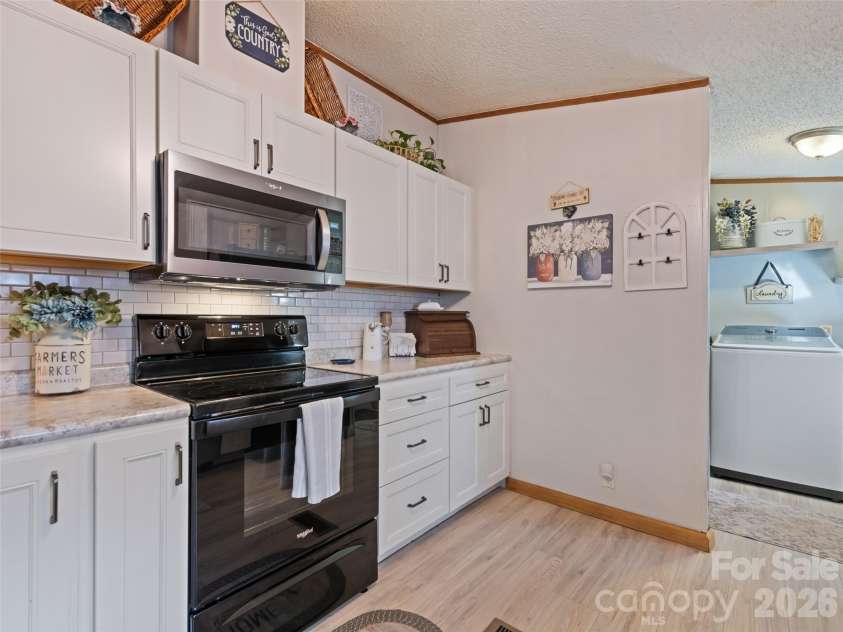 136 Peaceful Valley Drive, Leicester, NC 28748.  MLS# CAR4378331, YatesRealty ID 22556. Updated cabinets and countertops.