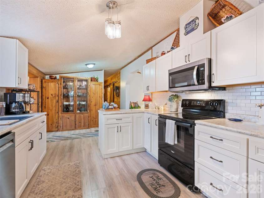 136 Peaceful Valley Drive, Leicester, NC 28748.  MLS# CAR4378331, YatesRealty ID 22556. Updated floors