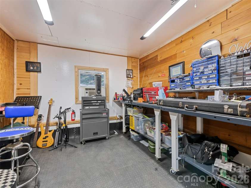 136 Peaceful Valley Drive, Leicester, NC 28748.  MLS# CAR4378331, YatesRealty ID 22556. Workshop off garage