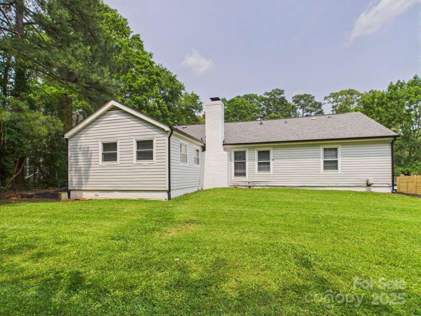4905 Chestnut Lake Drive, Charlotte, NC 28227.  MLS# CAR4263898, YatesRealty ID 22556. Back of the house and backyard