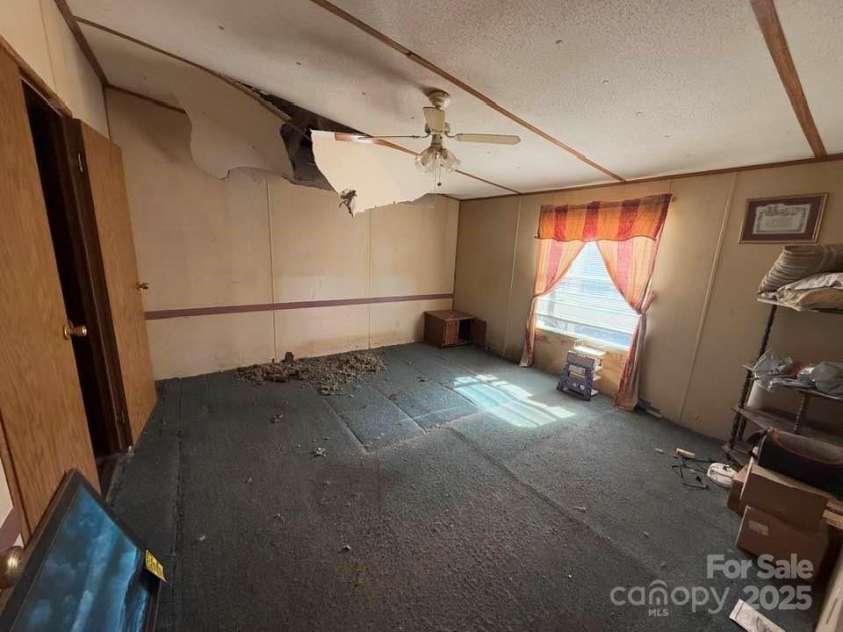 127 Round Top Road, Mill Spring, NC 28756.  MLS# CAR4217273, YatesRealty ID 2256. Damage from Hurricane
