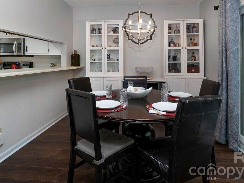 19823 Henderson Road, Cornelius, NC 28031.  MLS# CAR4374380, YatesRealty ID 22560. Dining Room with sliding glass doors to porch...