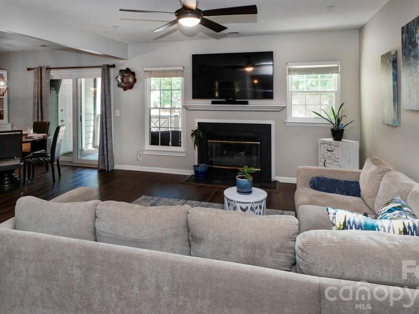 19823 Henderson Road, Cornelius, NC 28031.  MLS# CAR4374380, YatesRealty ID 22560. Living Room with fireplace...