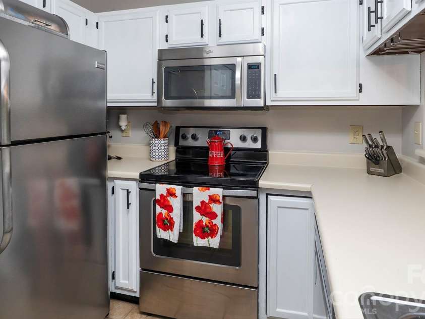 19823 Henderson Road, Cornelius, NC 28031.  MLS# CAR4374380, YatesRealty ID 22560. Lots of cabinets...