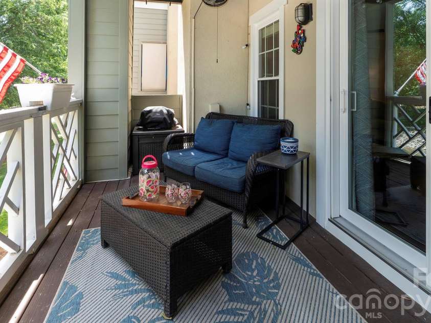 19823 Henderson Road, Cornelius, NC 28031.  MLS# CAR4374380, YatesRealty ID 22560. Porch over looking water...