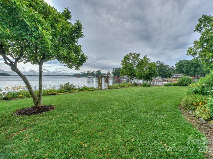 7945 Placid Court, Denver, NC 28037.  MLS# CAR4269290, YatesRealty ID 22561. Back yard view with original pergola overlooking main channel and sunrise views.
