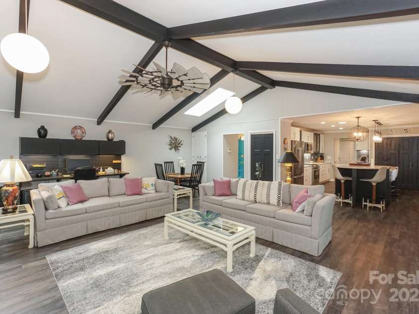 7945 Placid Court, Denver, NC 28037.  MLS# CAR4269290, YatesRealty ID 22561. Beams and globe lighting are original to the home and beautifully maintained in this large Great Room space and open to the kitchen-All with waterviews.