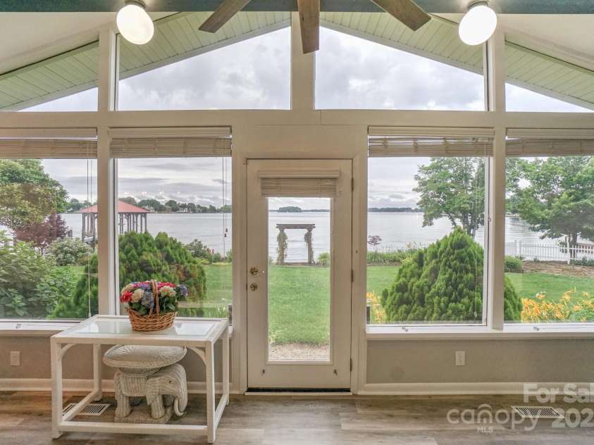 7945 Placid Court, Denver, NC 28037.  MLS# CAR4269290, YatesRealty ID 22561. Nothing but large windows on the back of the Sunroom that expands most of the back of the house and allows for great lighting! And look at that view!