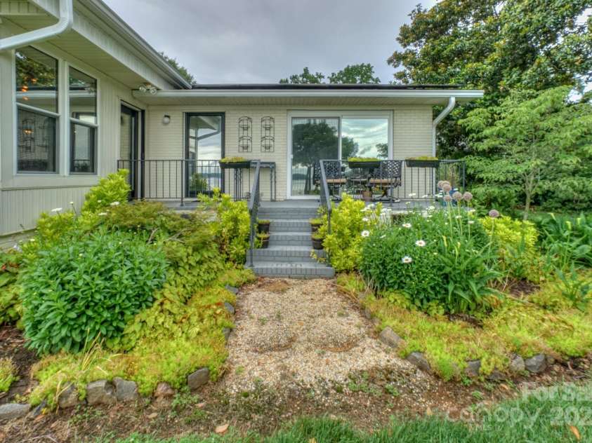 7945 Placid Court, Denver, NC 28037.  MLS# CAR4269290, YatesRealty ID 22561. Primary Suite private and waterfront porch with access to Sunroom.