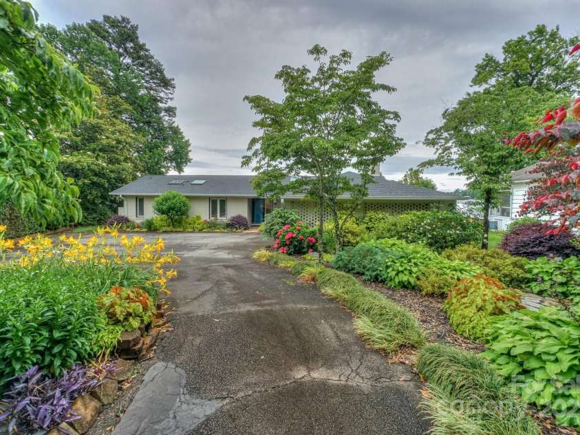 7945 Placid Court, Denver, NC 28037.  MLS# CAR4269290, YatesRealty ID 22561. Private driveway and stunning seasonal landscaping makes this home private and enjoyable