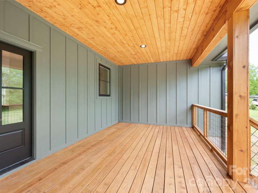 34 Old Souther Road, Mills River, NC 28759.  MLS# CAR4380756, YatesRealty ID 22562. Covered back deck