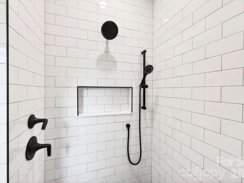 34 Old Souther Road, Mills River, NC 28759.  MLS# CAR4380756, YatesRealty ID 22562. Floor to ceiling tiled primary shower