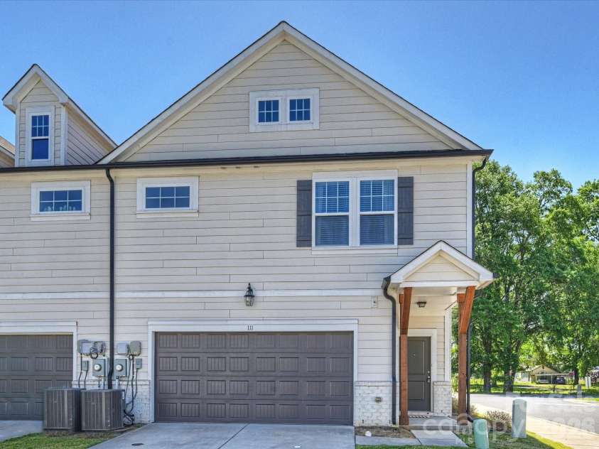 111 Cranford Drive, Pineville, NC 28134.  MLS# CAR4381418, YatesRealty ID 22566. Back door with 2 car garage