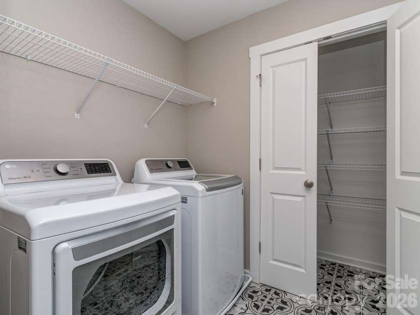 111 Cranford Drive, Pineville, NC 28134.  MLS# CAR4429371, YatesRealty ID 22566. Full laundry room with storage