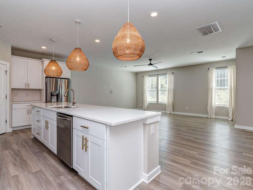 111 Cranford Drive, Pineville, NC 28134.  MLS# CAR4429371, YatesRealty ID 22566. Quartz countertops and tile backsplash