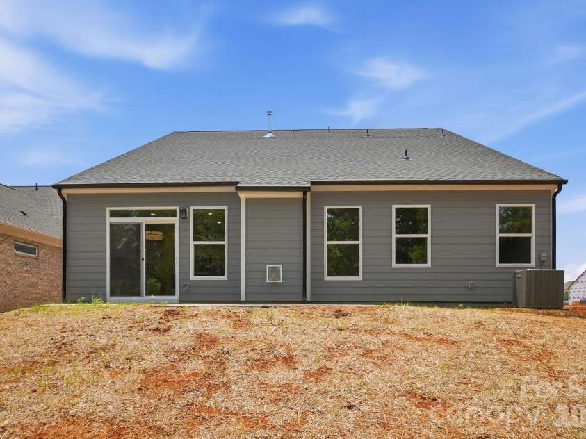 3050 Constitution Lane, Gastonia, NC 28056.  MLS# CAR4349382, YatesRealty ID 22570. Backyard- grass is in progress
