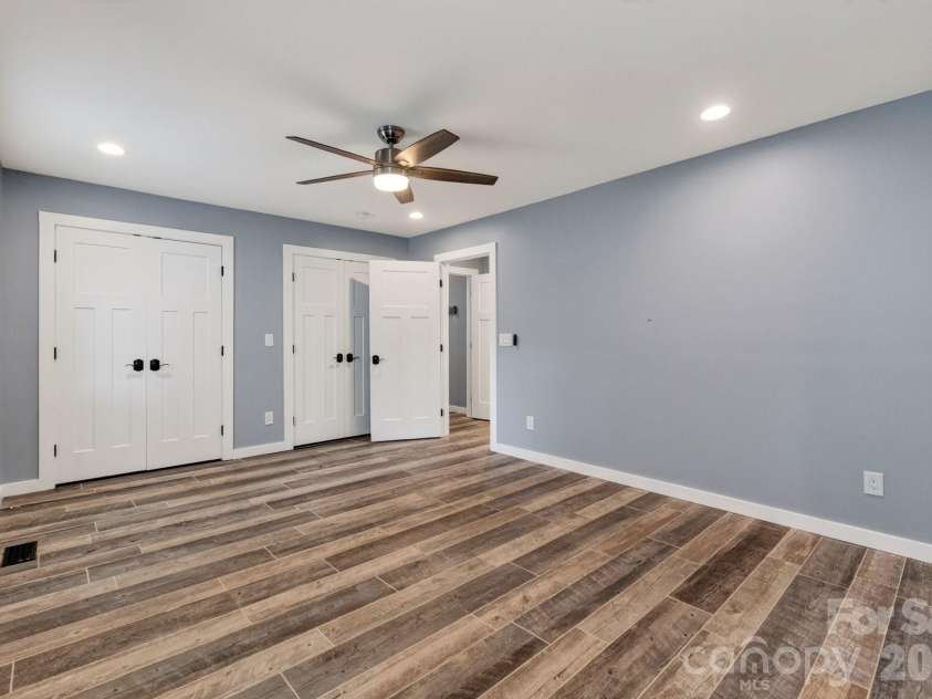 21200 Rio Oro Drive, Cornelius, NC 28031.  MLS# CAR4396261, YatesRealty ID 22574. Bedroom #3 features two double door closets