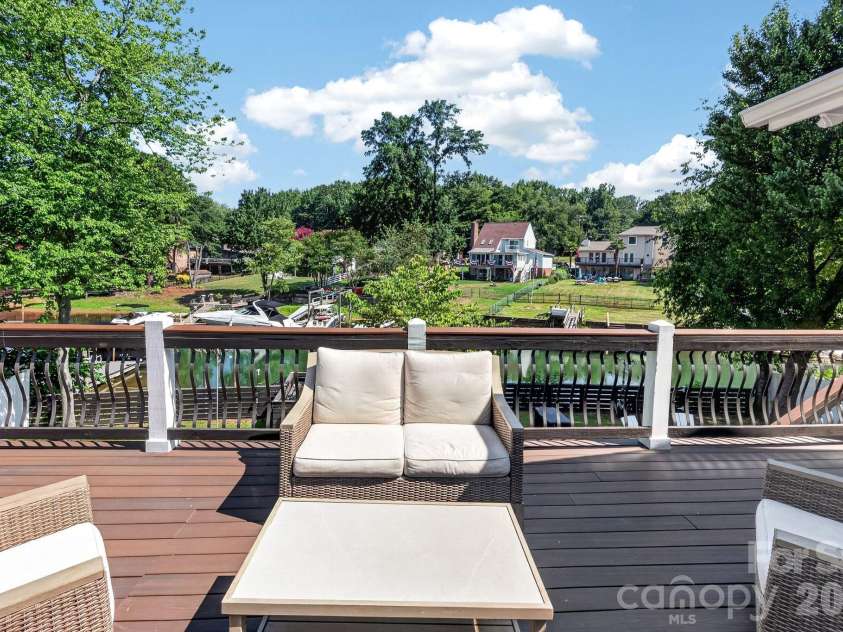 21200 Rio Oro Drive, Cornelius, NC 28031.  MLS# CAR4396261, YatesRealty ID 22574. Upper deck lounging area with water views.