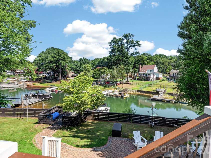 21200 Rio Oro Drive, Cornelius, NC 28031.  MLS# CAR4396261, YatesRealty ID 22574. View of the backyard from the upper deck.