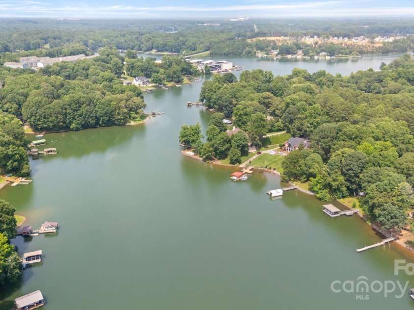 6836 Summer Hill Drive, Denver, NC 28037.  MLS# CAR4271136, YatesRealty ID 22574. Soak in serene lake views across the wide cove from the spacious rear porch.