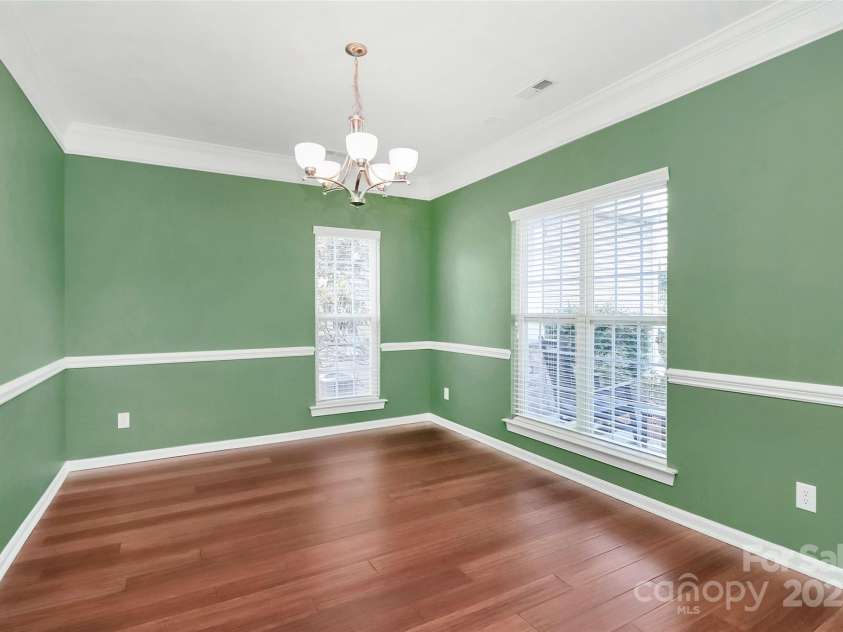 1618 Bay Meadows Avenue, Concord, NC 28027.  MLS# CAR4259621, YatesRealty ID 22575. Dining room with hardwoods, chair rail