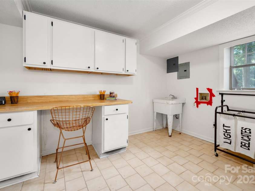 6259 River Cabin Lane, Charlotte, NC 28278.  MLS# CAR4271955, YatesRealty ID 22576. Basement work room/second laundry room.