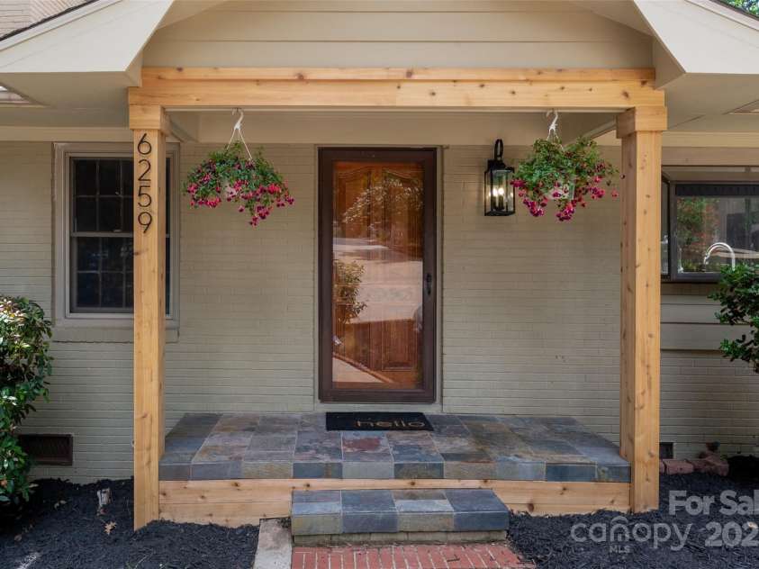 6259 River Cabin Lane, Charlotte, NC 28278.  MLS# CAR4271955, YatesRealty ID 22576. Front porch with brand new cedar beams, stained door and outdoor lighting.