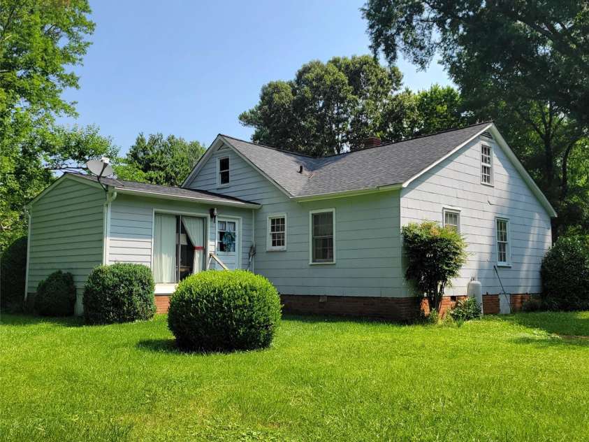 6908 Alexander Road, Charlotte, NC 28270.  MLS# CAR4274834, YatesRealty ID 22577. Rear view of house